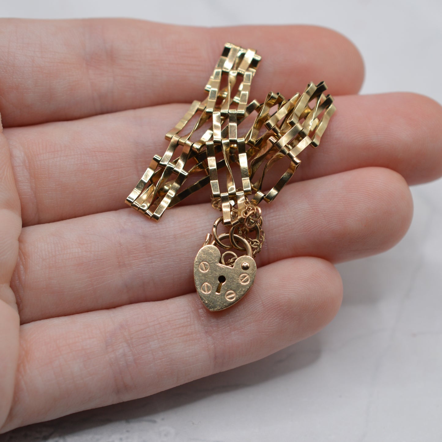 1980s 9ct Gold Three-Bar Gate Bracelet with Heart Padlock (7.5”)