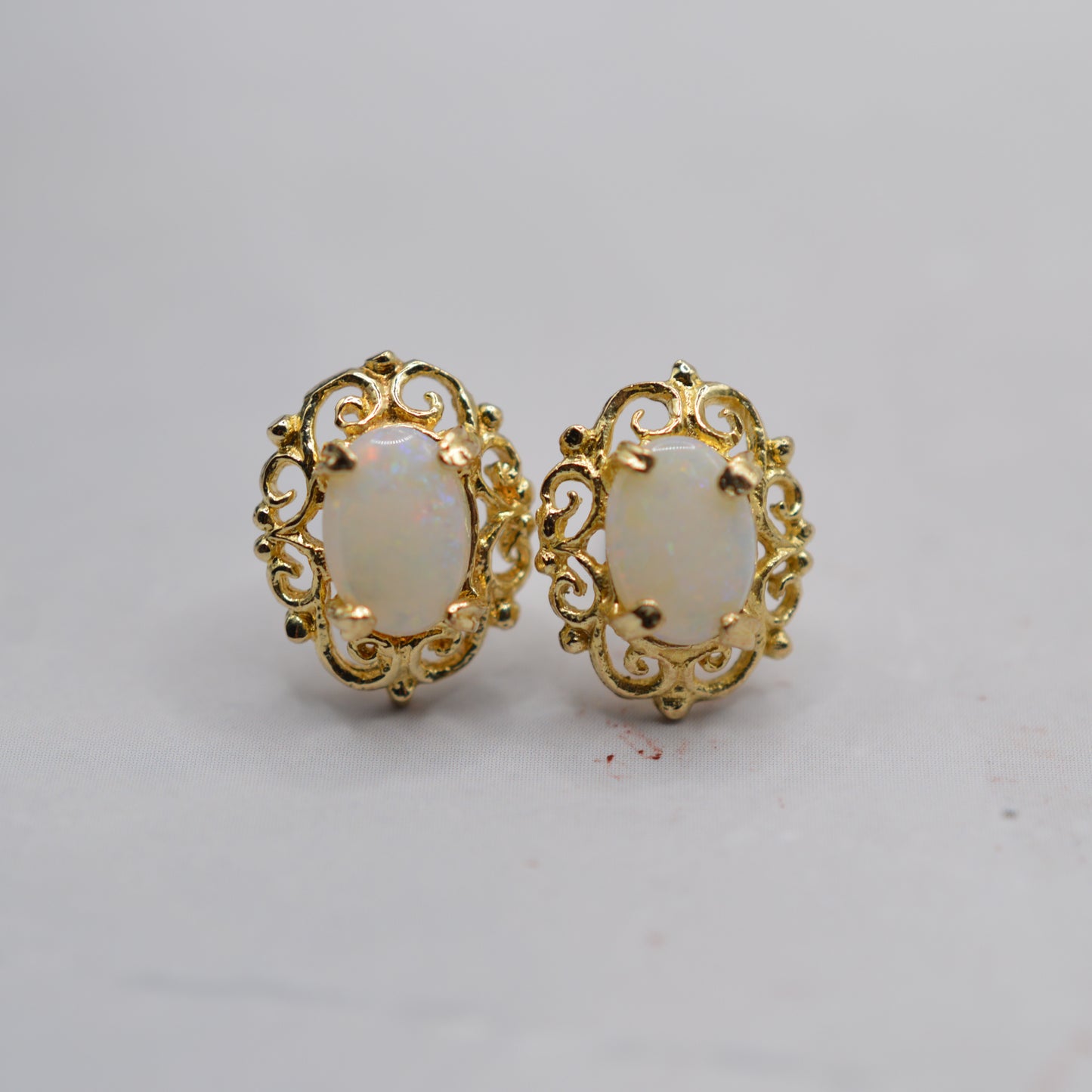 9ct Gold Opal Stud Earrings with Swirl Piercings