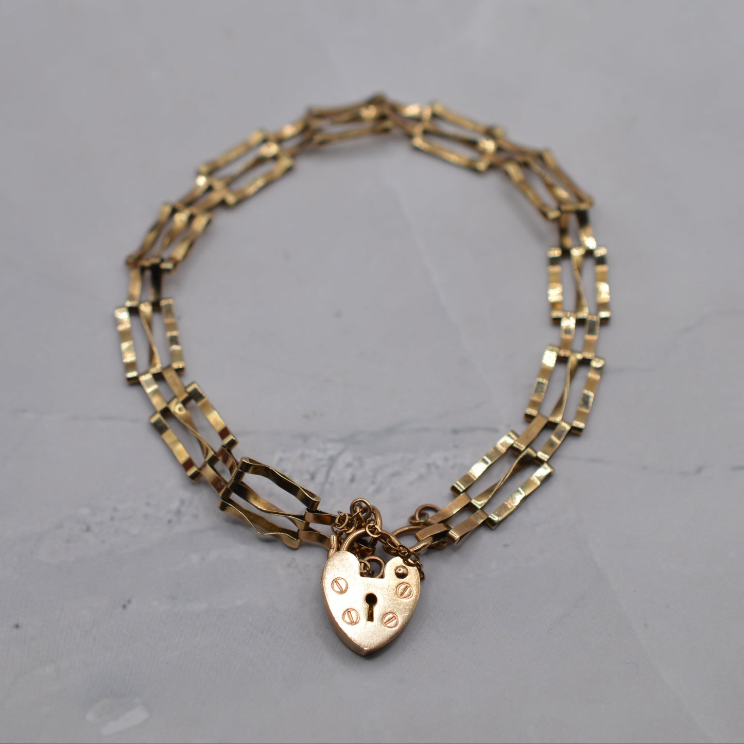 1980s 9ct Gold Three-Bar Gate Bracelet with Heart Padlock (7.5”) 