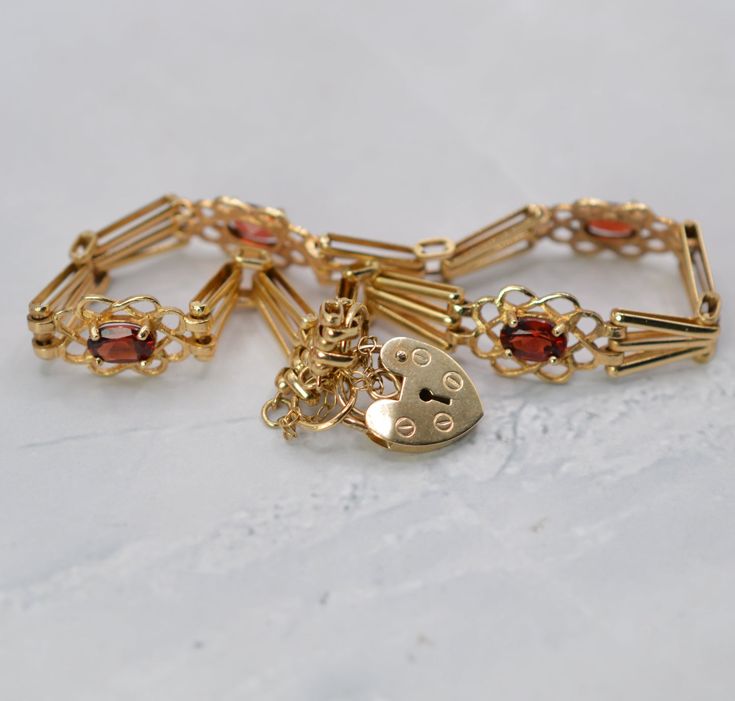 9ct Gold Garnet Gate Bracelet with Heart Padlock & Safety Chain (7")