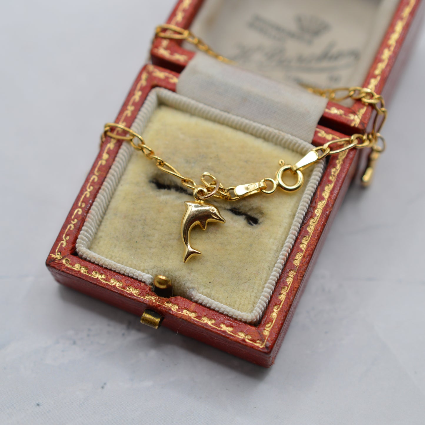 9ct Gold Five-Charm Figaro Bracelet (7”)