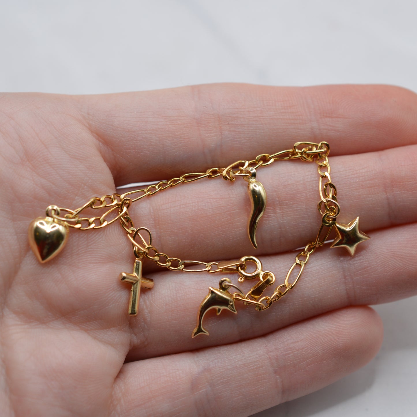 9ct Gold Five-Charm Figaro Bracelet (7”)
