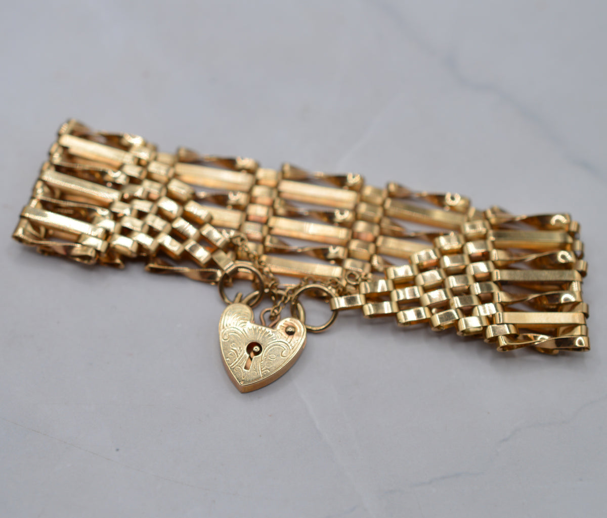 1970s Heavy Vintage 9ct Gold Seven-Bar Gate Bracelet with Heart Padlock (7”)
