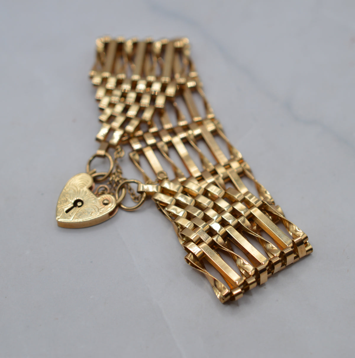 1970s Heavy Vintage 9ct Gold Seven-Bar Gate Bracelet with Heart Padlock (7”)