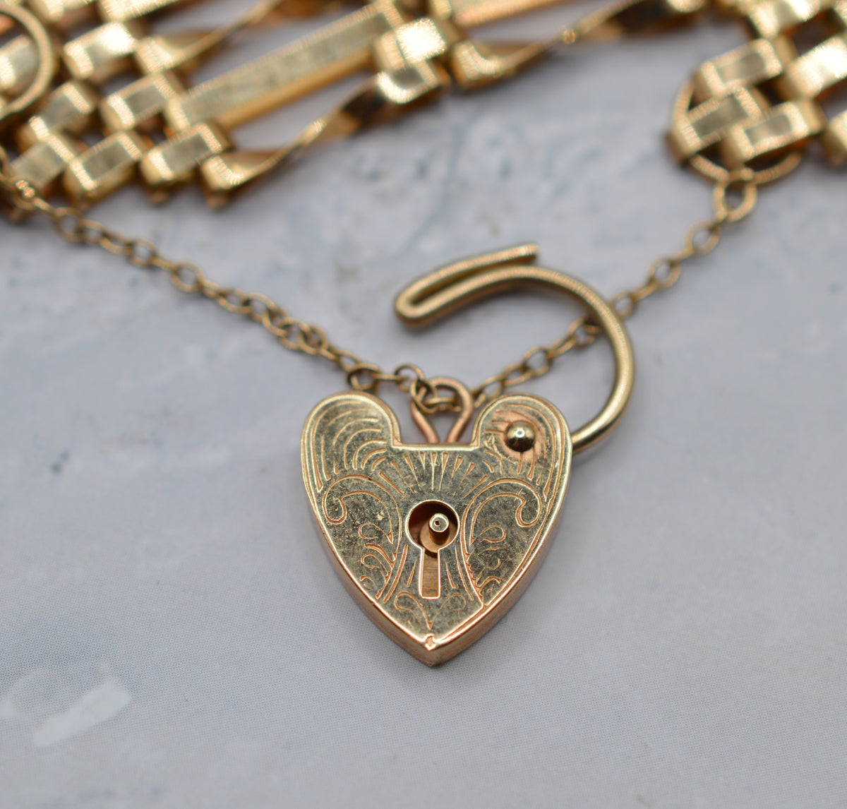 1970s Heavy Vintage 9ct Gold Seven-Bar Gate Bracelet with Heart Padlock (7”)