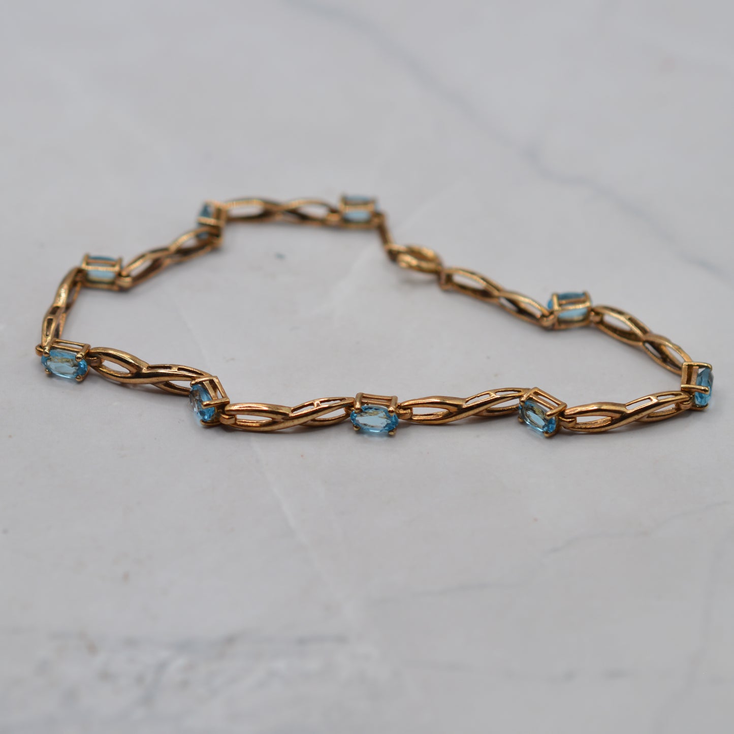 9ct Gold Blue Topaz Infinity Link Bracelet (7.5")