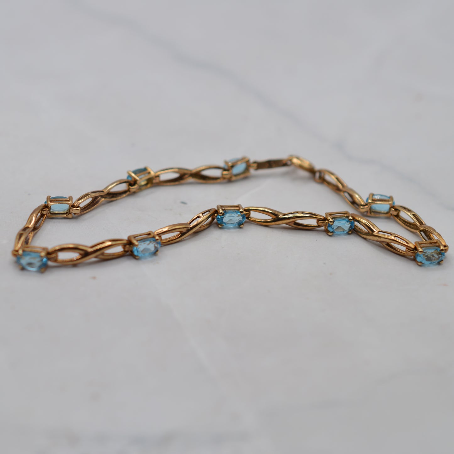 9ct Gold Blue Topaz Infinity Link Bracelet (7.5")