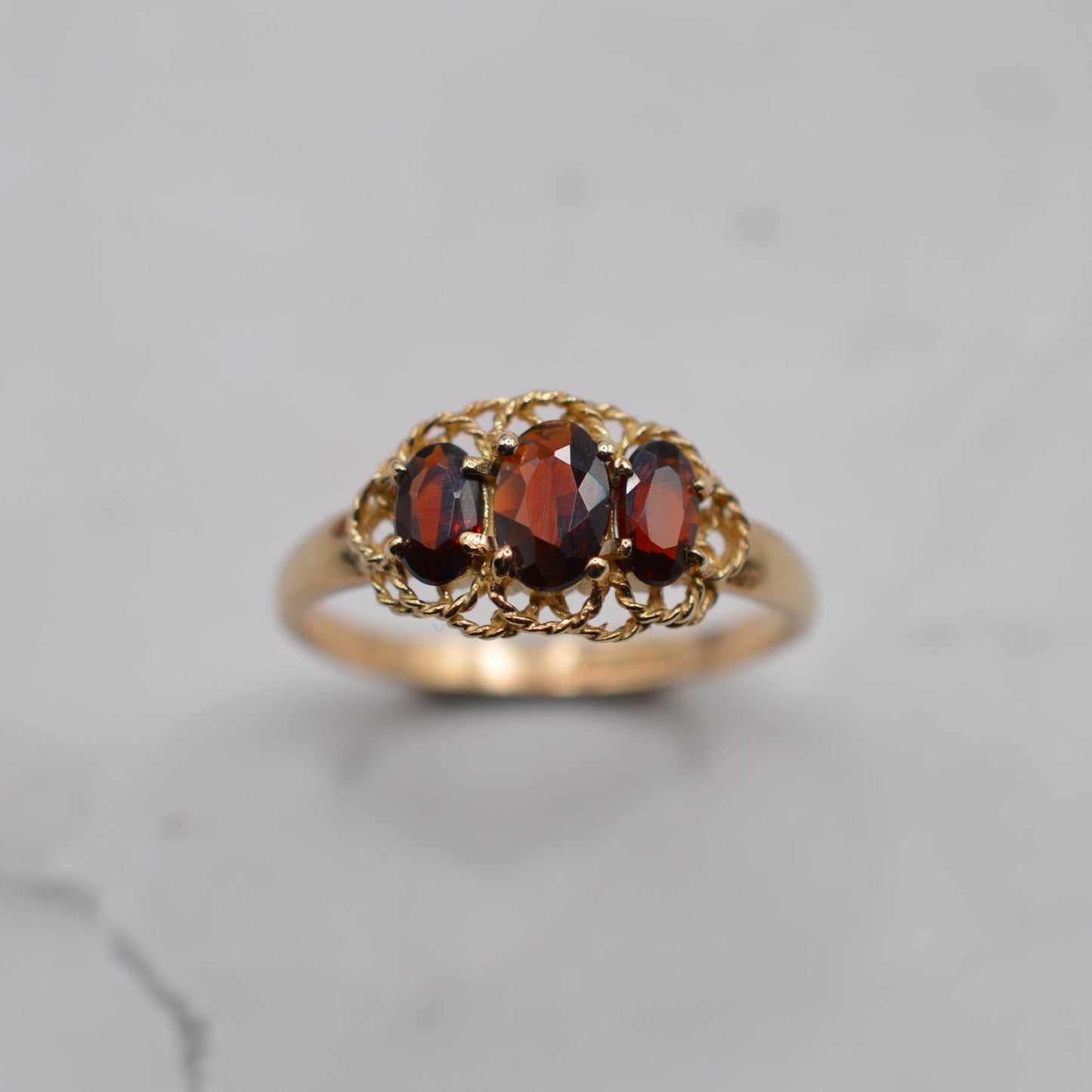 9ct Gold Garnet Trilogy Ring with Rope-Twist Frame