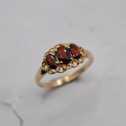 9ct Gold Garnet Trilogy Ring with Rope-Twist Frame