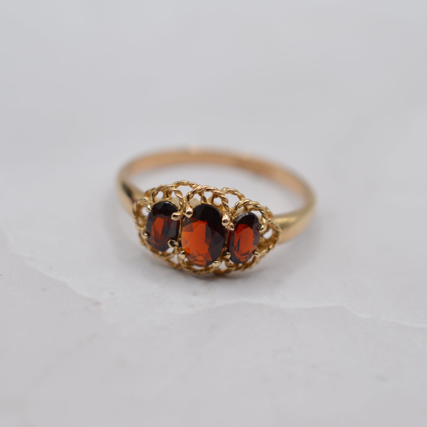 9ct Gold Garnet Trilogy Ring with Rope-Twist Frame