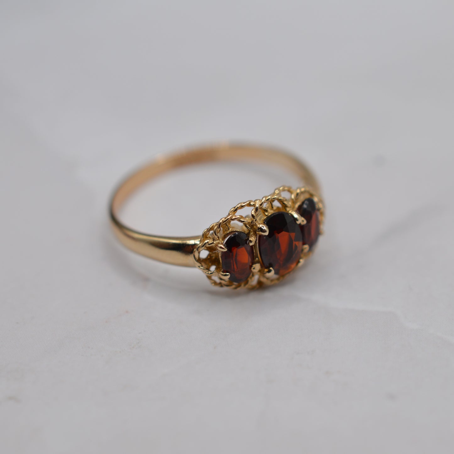 9ct Gold Garnet Trilogy Ring with Rope-Twist Frame