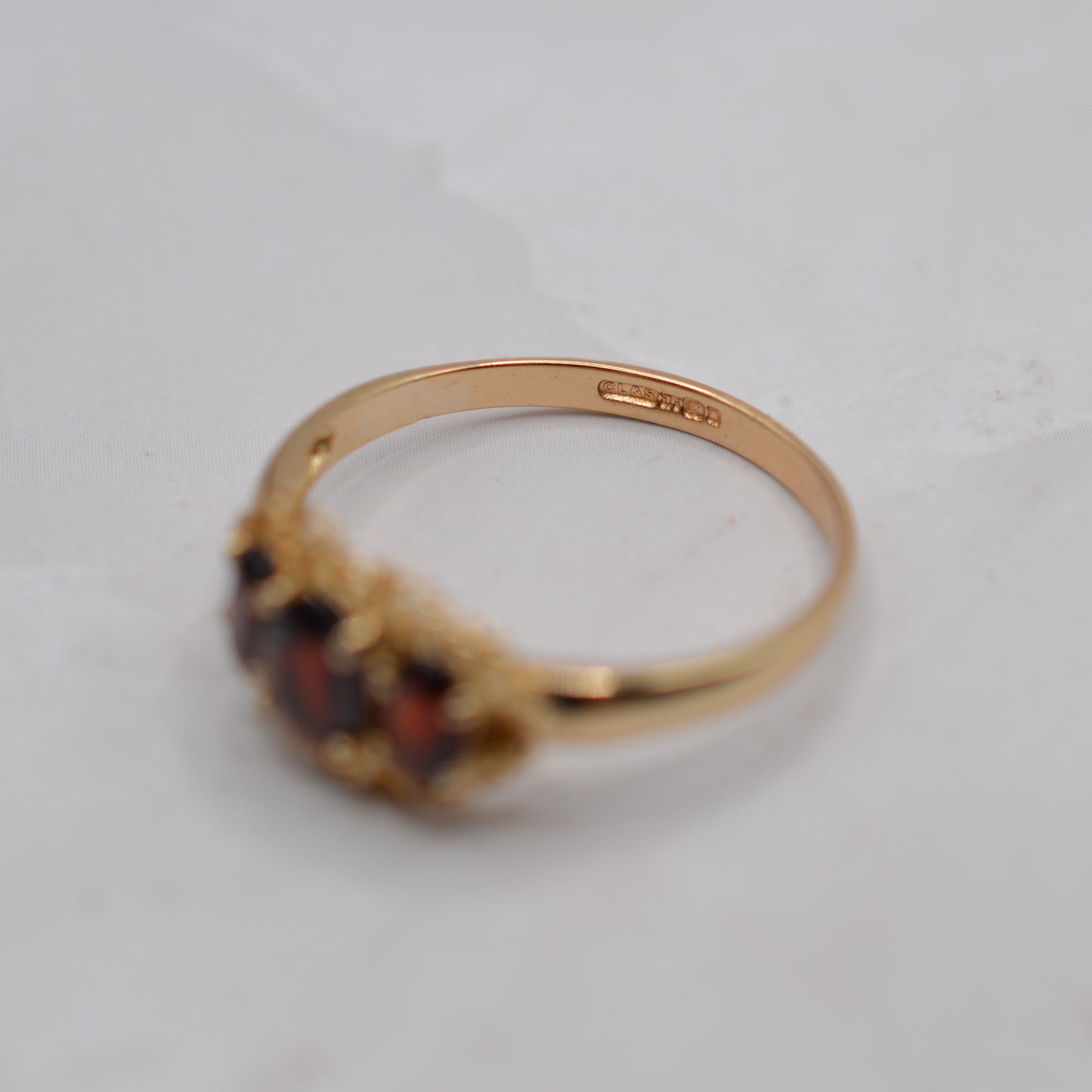 9ct Gold Garnet Trilogy Ring with Rope-Twist Frame