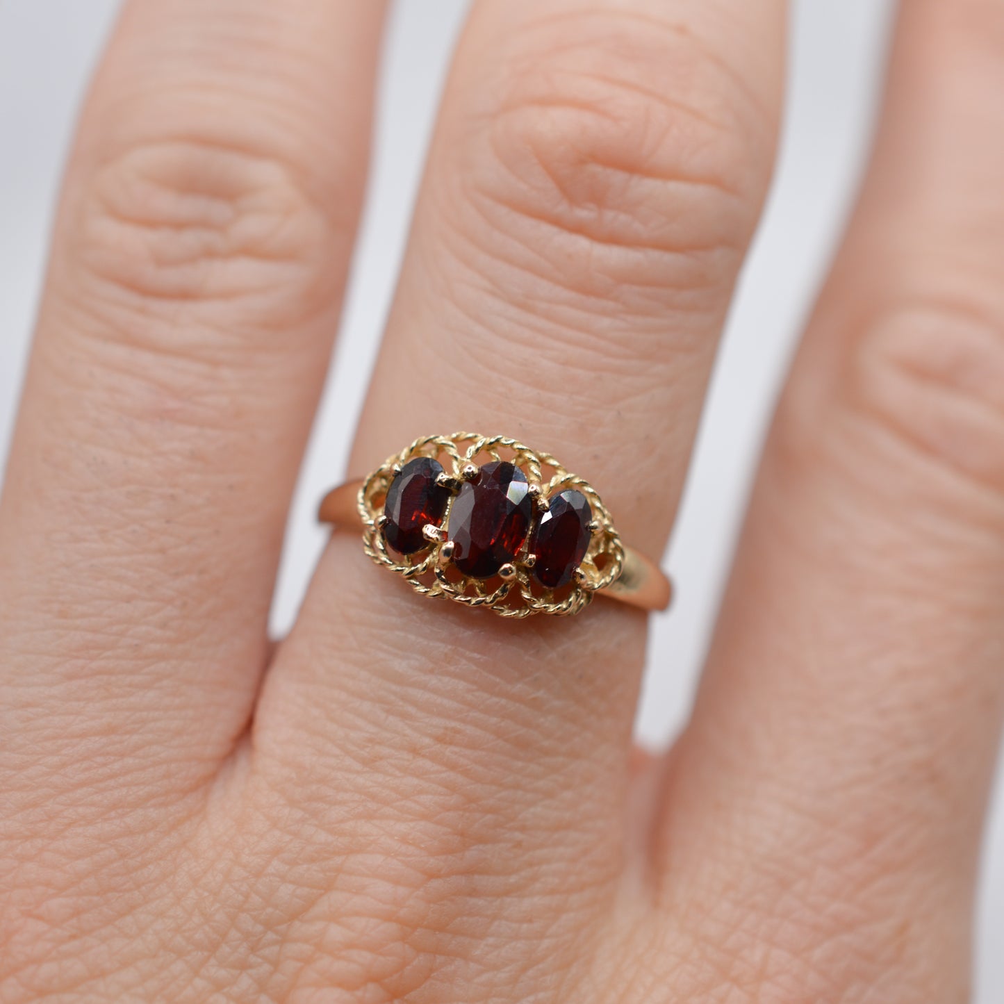 9ct Gold Garnet Trilogy Ring with Rope-Twist Frame
