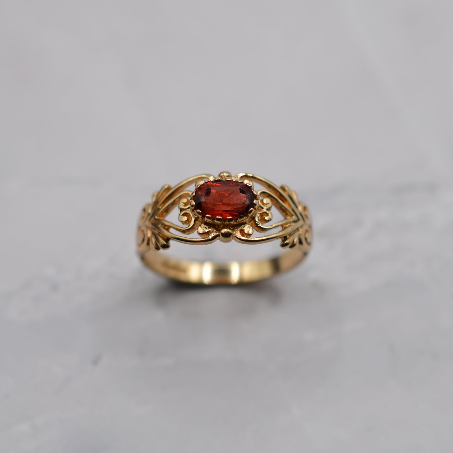 9ct Gold Garnet Open-Work Swirl Ring
