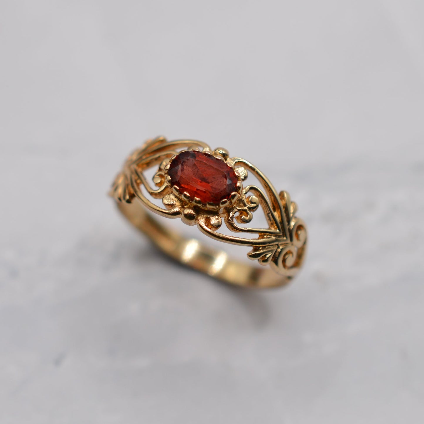 9ct Gold Garnet Open-Work Swirl Ring