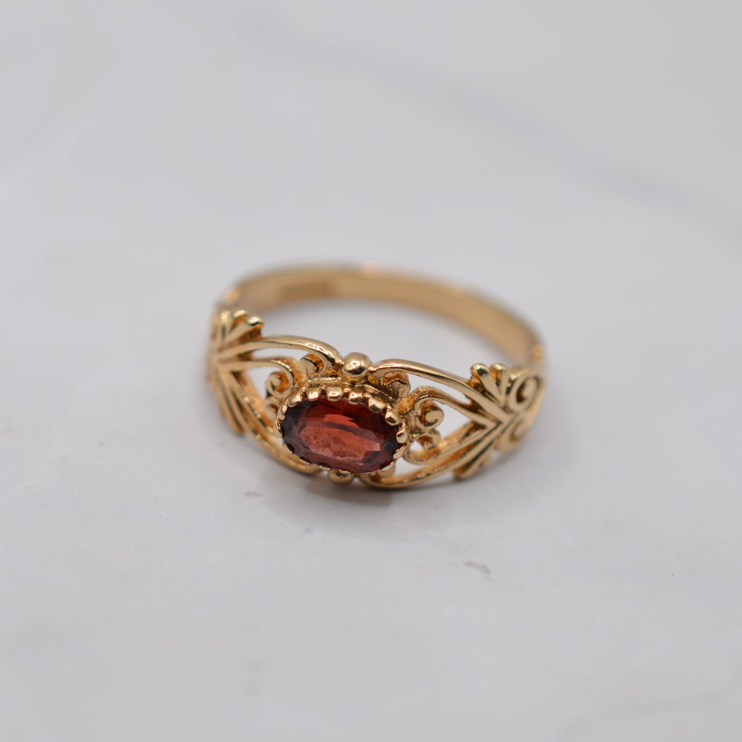 9ct Gold Garnet Open-Work Swirl Ring