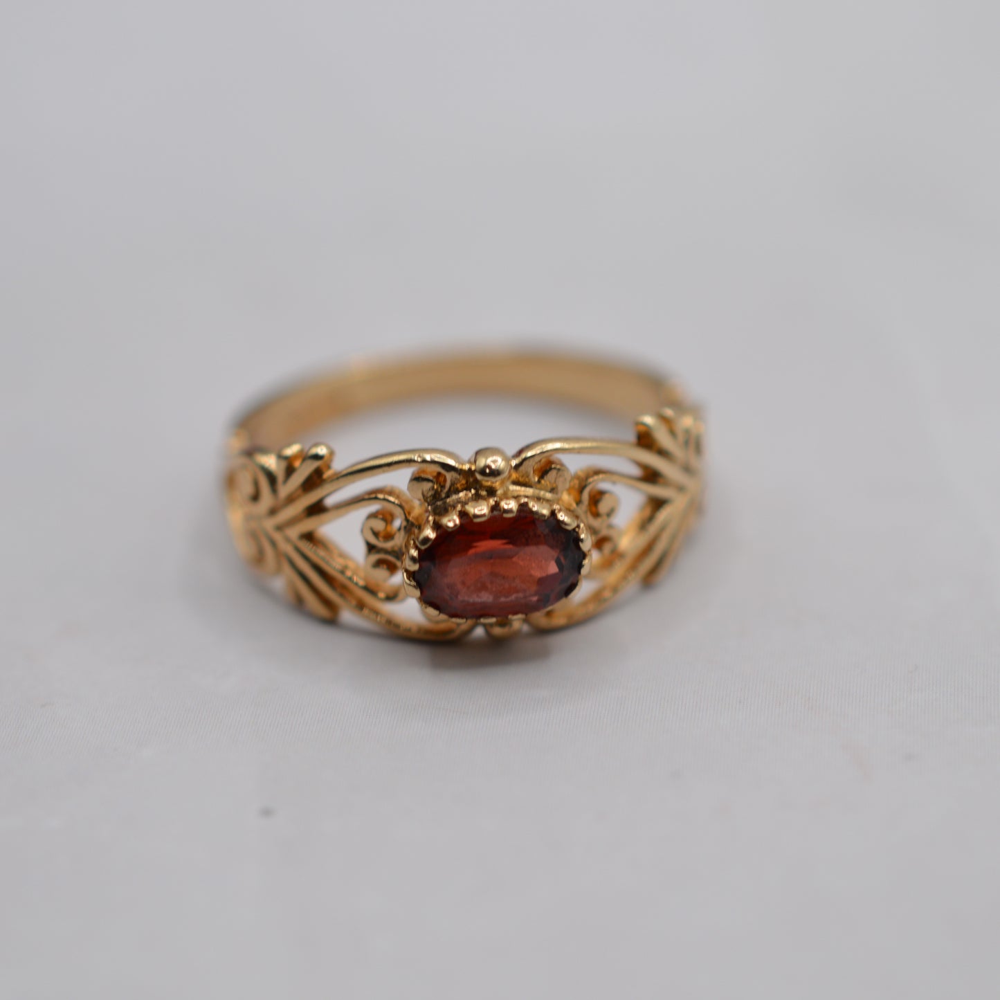 9ct Gold Garnet Open-Work Swirl Ring