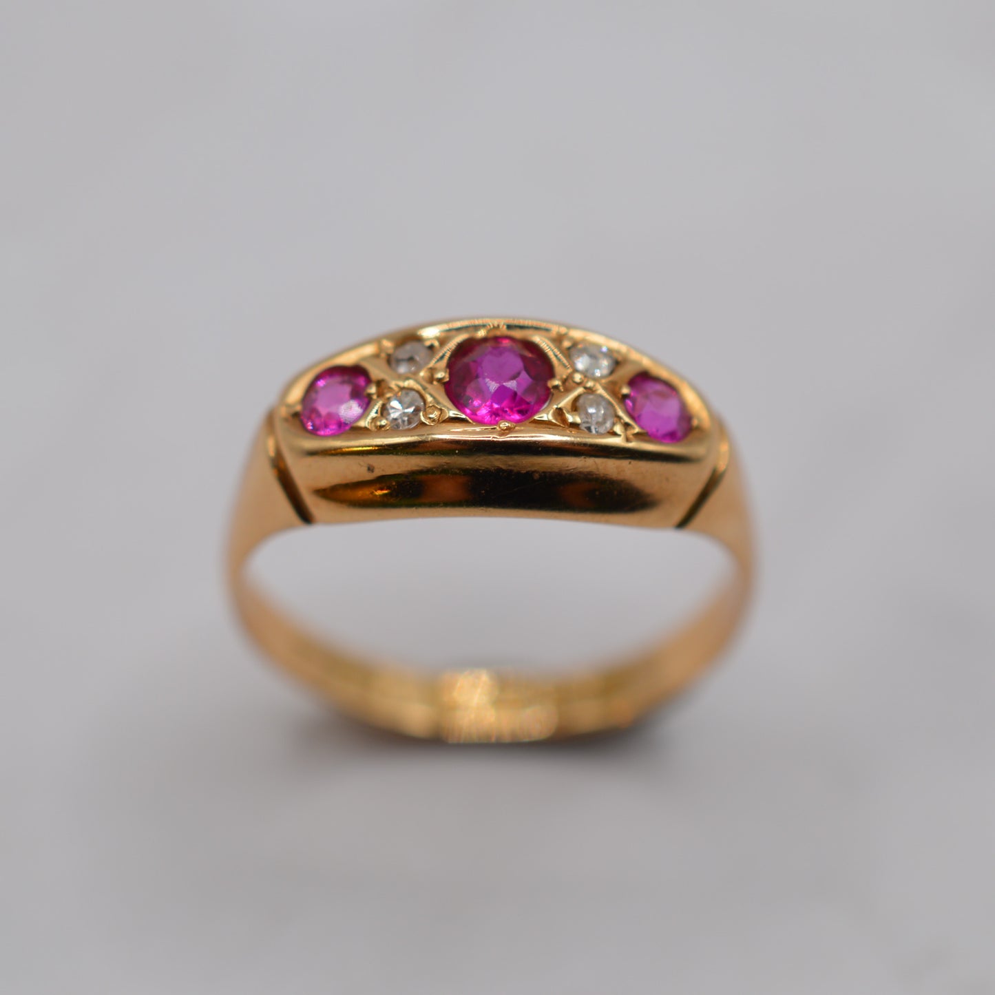 Antique 1910s 18ct Gold Ruby & Diamond Seven-Stone Ring