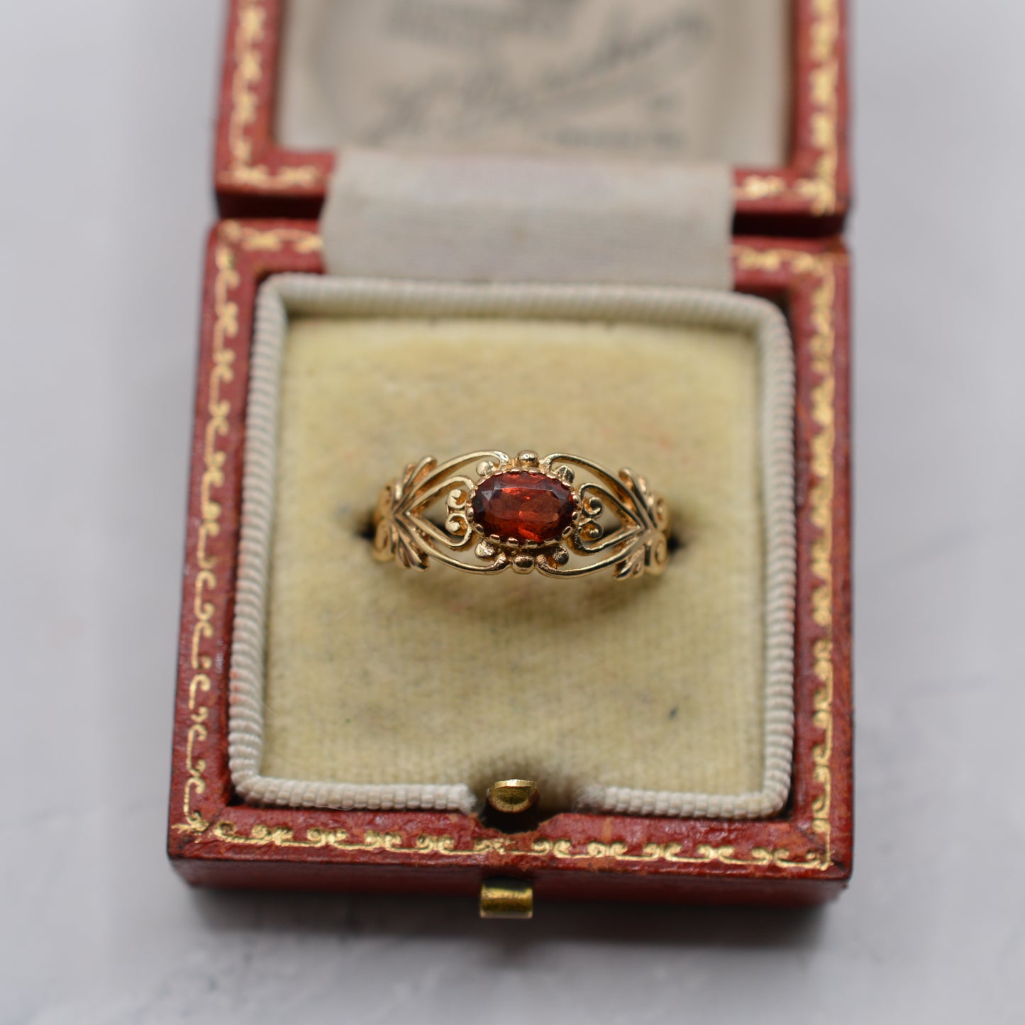 9ct Gold Garnet Open-Work Swirl Ring
