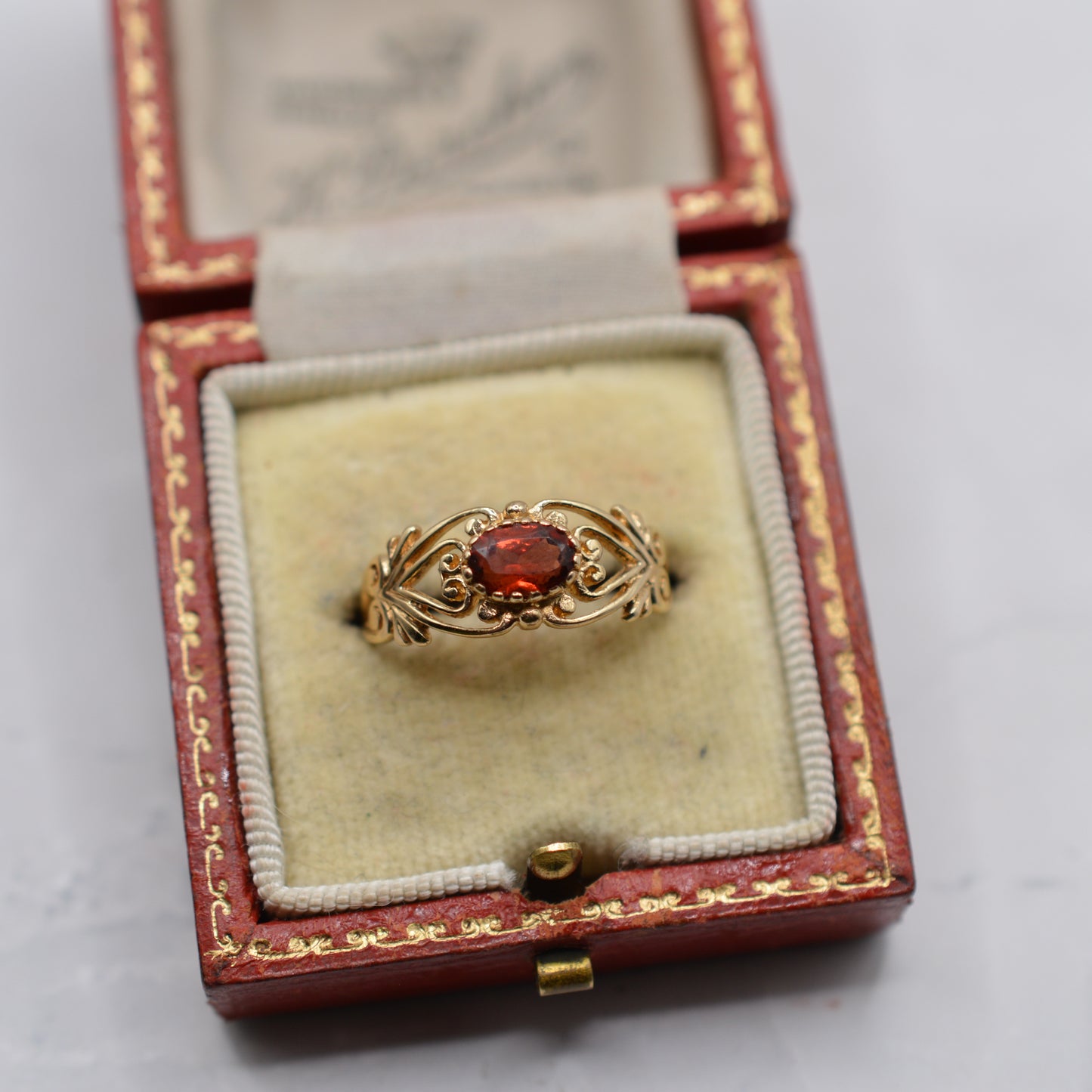9ct Gold Garnet Open-Work Swirl Ring