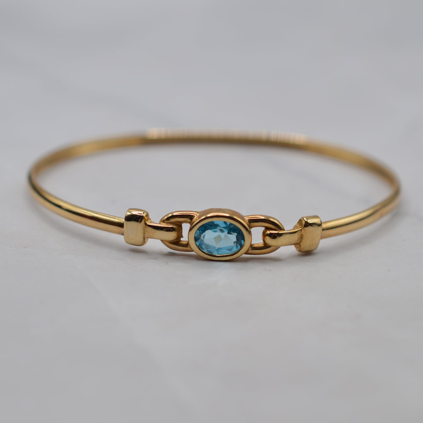 9ct Gold Blue Topaz Solitaire Bangle Bracelet