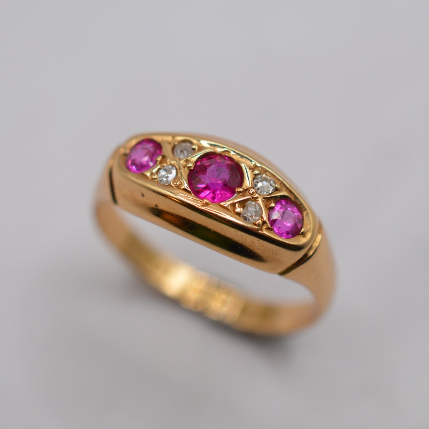 Antique 1910s 18ct Gold Ruby & Diamond Seven-Stone Ring