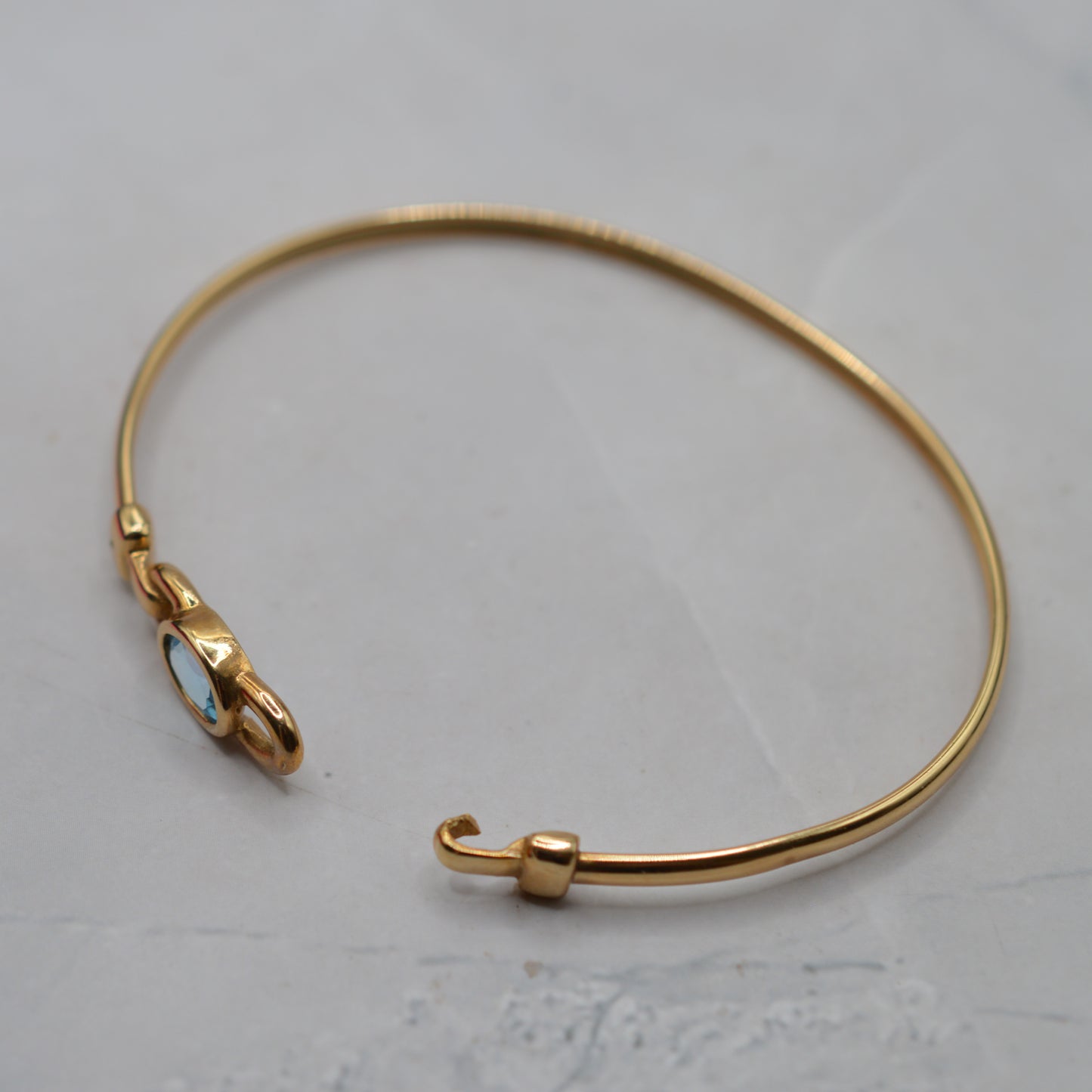 9ct Gold Blue Topaz Solitaire Bangle Bracelet