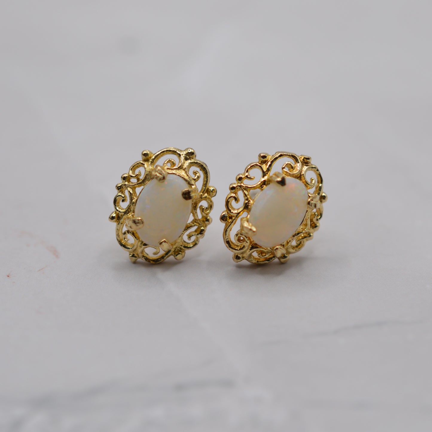 9ct Gold Opal Stud Earrings with Swirl Piercings