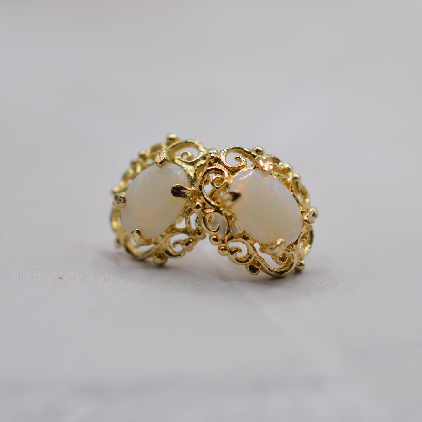 9ct Gold Opal Stud Earrings with Swirl Piercings