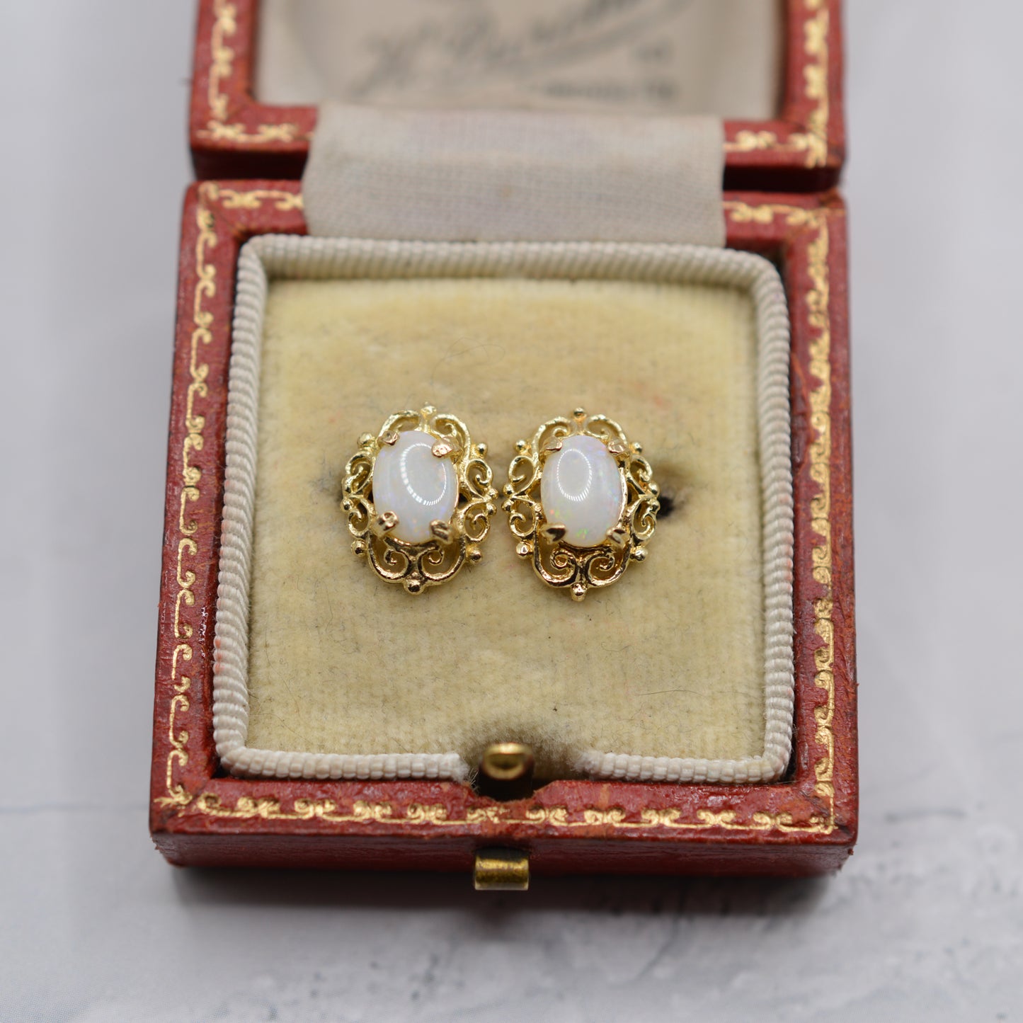 9ct Gold Opal Stud Earrings with Swirl Piercings