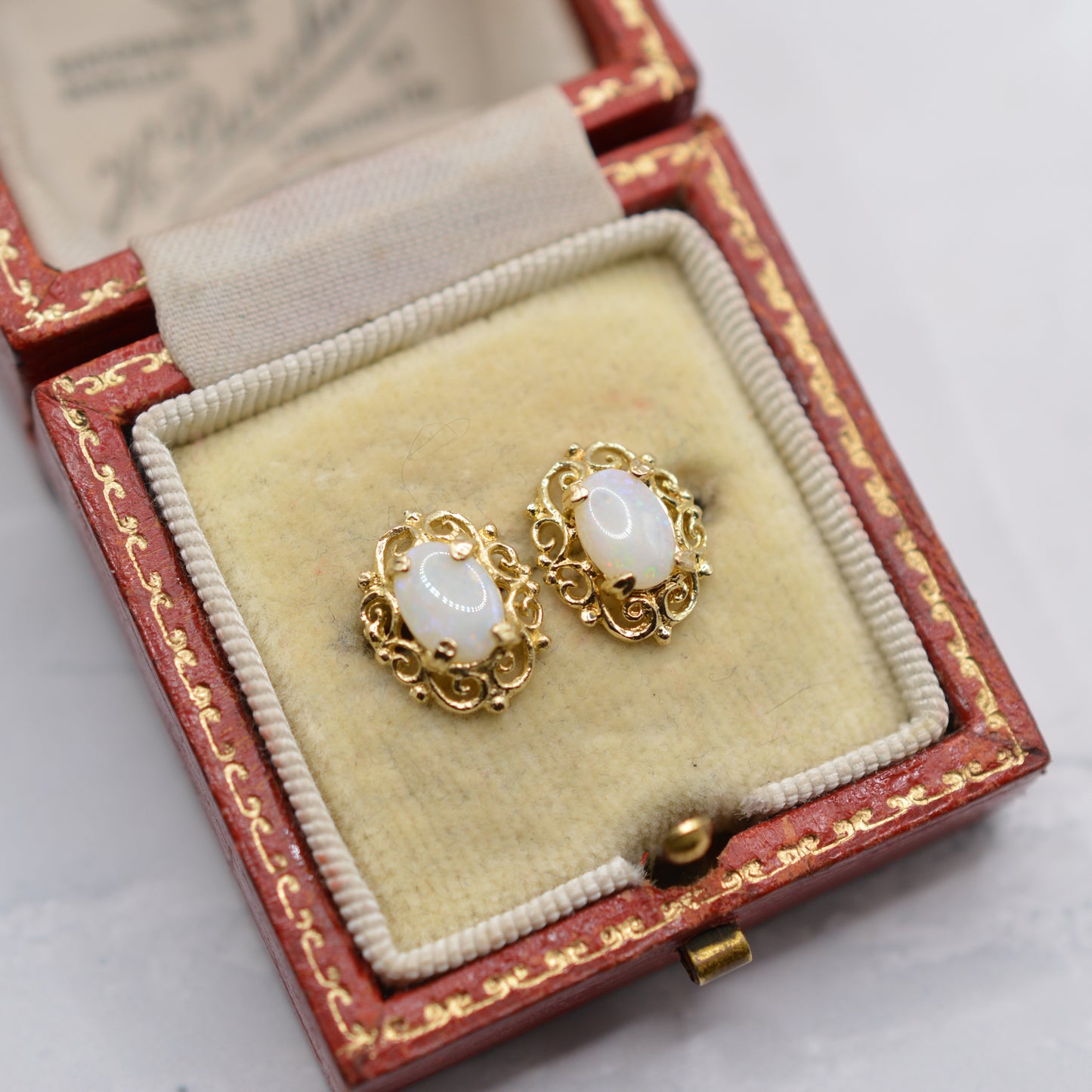 9ct Gold Opal Stud Earrings with Swirl Piercings