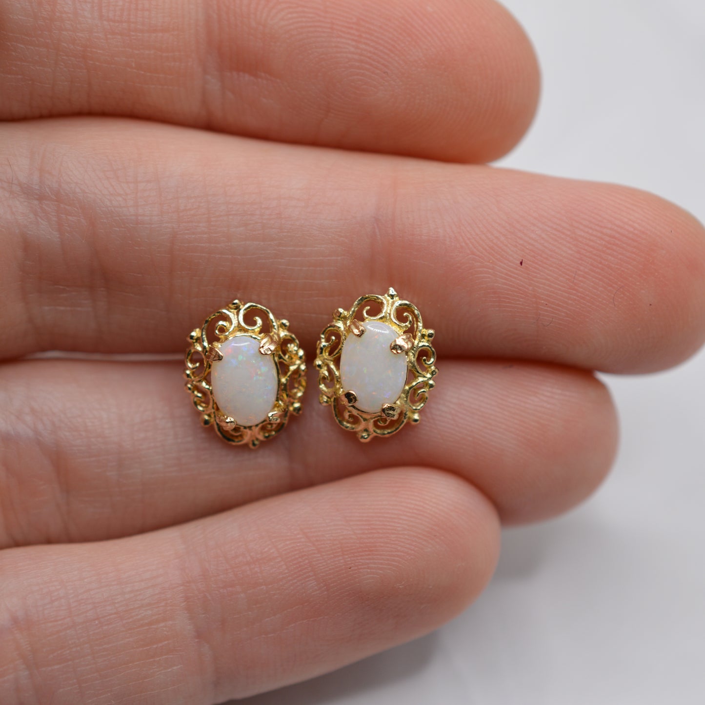 9ct Gold Opal Stud Earrings with Swirl Piercings