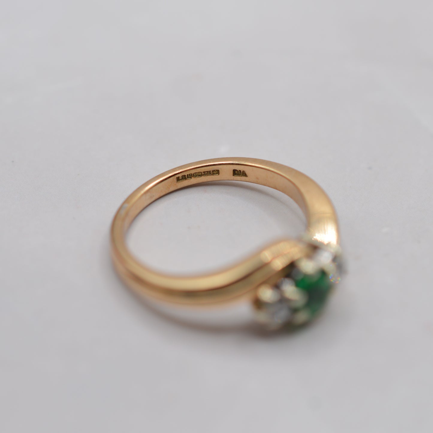 9ct Gold Emerald & Diamond Crossover Trilogy Ring