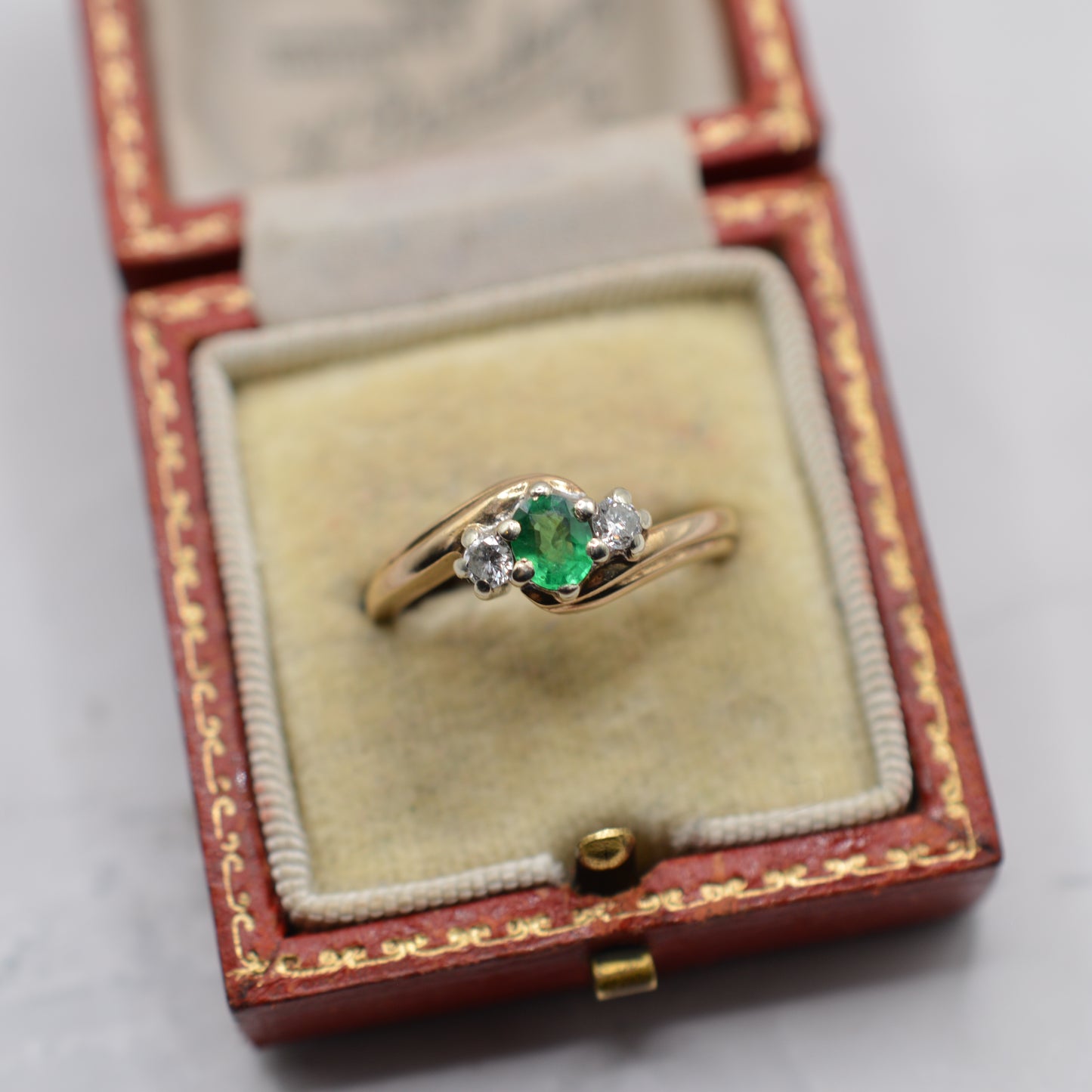9ct Gold Emerald & Diamond Crossover Trilogy Ring